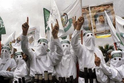Just look at these crazed, bigoted Teabaggers in their white KKK sheets with all kinds of weapons strapped to them. Sickening! Oh, wait. Those are Hamas guys. Never mind, we're cool with them because they're all ethnic and diverse and stuff.